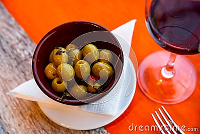 Plate of pickled green olives without stone, spanish appetizer - Olivas verdes sin hueso Stock Photo