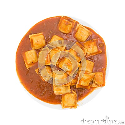 Plate of ravioli on a white background top view. Stock Photo