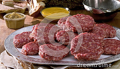 A plate of raw meat patties Stock Photo