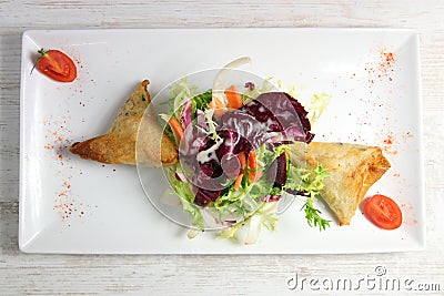 Plate of samoussa and lettuce salad Stock Photo