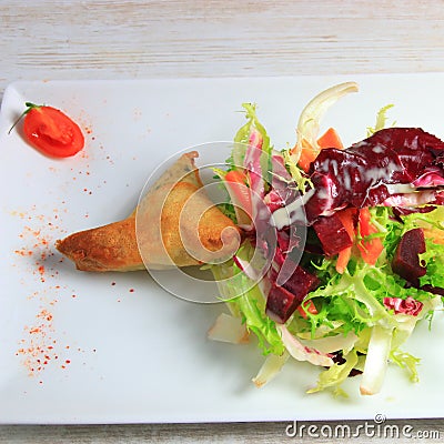 Plate of samoussa and lettuce salad Stock Photo