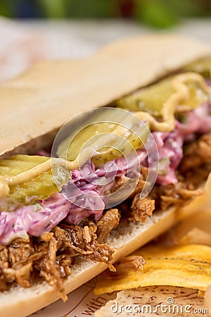Plate with a sandwich, chips, and pickles Stock Photo