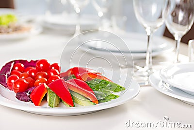 Plate with sliced vegetables Stock Photo