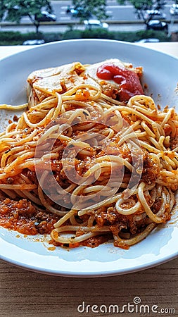 a plate of spaghetti with meat and tomato sauce Stock Photo