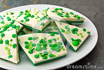 Plate of St Patricks Day candy bark with shamrock sprinkles Stock Photo