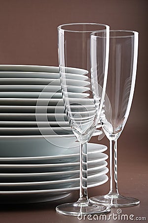 Plate stack and glasses Stock Photo