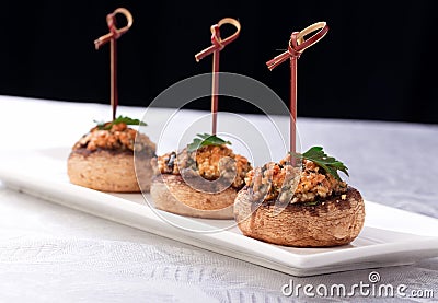 Plate with stuffed mushroom caps. Stock Photo