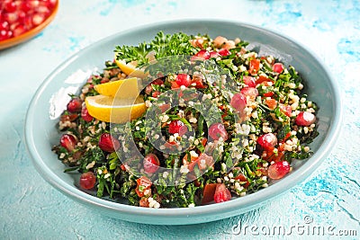 A plate of tabbouleh salad, close-up. Traditional Arabic food. Stock Photo