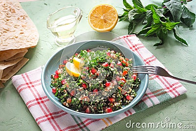 A plate of tabbouleh salad. Traditional Arabic food. Stock Photo