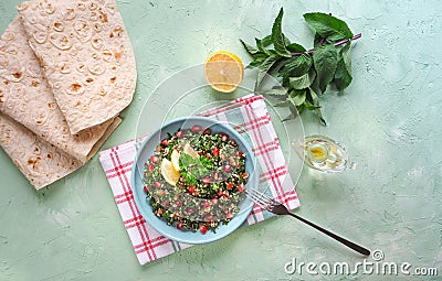 A plate of tabbouleh salad. Traditional Arabic food. Stock Photo