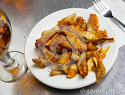 Plate of tasty roasted artichokes closeup. Spanish dish Stock Photo