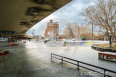 Skate park under Van Horn overpass and wharehouse in the back in Montreal Editorial Stock Photo