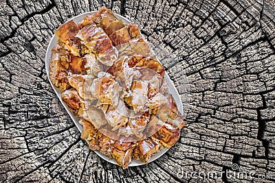 Plateful Of Spit Roasted Pork Meat Slices Set On Old Weathered Cracked Stump Picnic Table Stock Photo