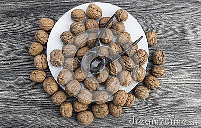 Plates of natural walnuts and walnut crumbs A plate of dry walnuts, the most wonderful walnut pictures Stock Photo