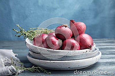 Plates with ripe red onions Stock Photo