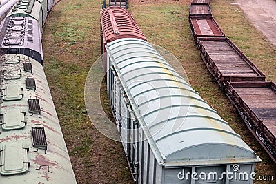 Platform and covered wagons. Several railway tracks. Logistics, import and export Stock Photo