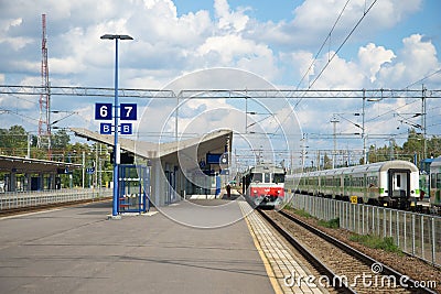 On the platform of the railway station of Kouvola cloud on a summer day Editorial Stock Photo