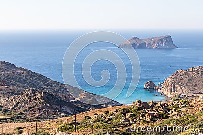 Plathiena beach with cliffs and island in background Stock Photo