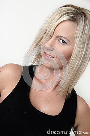 Platinum blonde model in black tank top Stock Photo