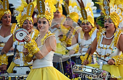 Female Carnival Dancers and drummers in Flamboyant Yellow Costumes. Editorial Stock Photo