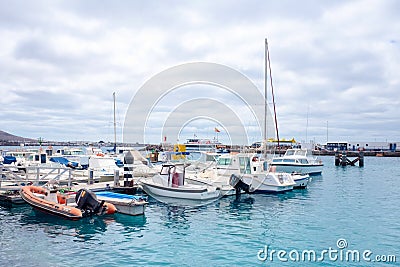 Playa Blanka, Lanzarote, Spain - 1972017: Small yachts moored in the marina of Playa Blanca Editorial Stock Photo