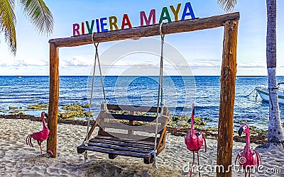 Colorful Riviera Maya swing lettering sign symbol on beach Mexico Editorial Stock Photo