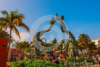 Playa del Carmen, Riviera Maya, Mexico: People on the beach in Playa del Carmen. Entrance to the beach in the form of sculptures o Editorial Stock Photo