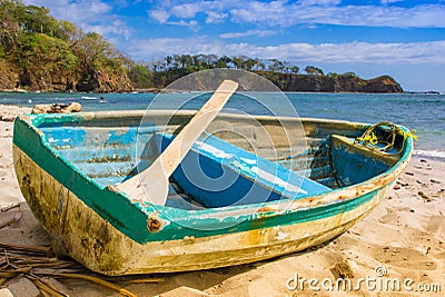 PLAYA MONTEZUMA, COSTA RICA, JUNE, 28, 2018: Outdoor view of small boat in the shore in Playa Montezuma during gorgeous Editorial Stock Photo