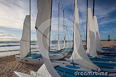 Colorful sail catamarans on the beach at Caribbean Sea of Mexico. Editorial Stock Photo