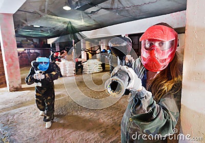 Player in red mask in paintball club Stock Photo