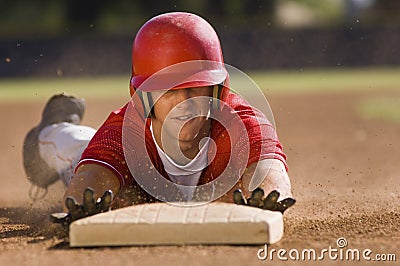 Player Sliding Towards Base Stock Photo