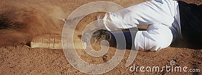 Player Sliding Towards Base On Field Stock Photo