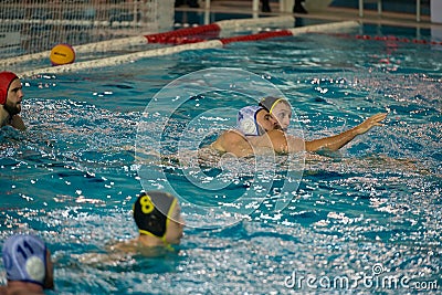 Players in action in water polo game Editorial Stock Photo