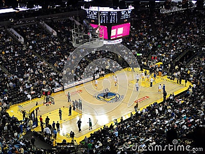 Players shoot around to warm-up during halftime Editorial Stock Photo