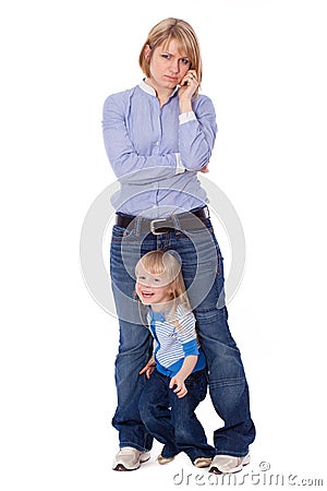 Playful child disturb mother to talk on cell Stock Photo