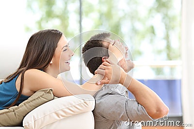 Playful couple at home Stock Photo