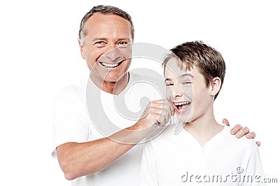 Playful father and son, pinching cheeks Stock Photo