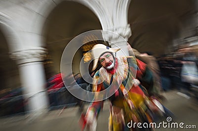 A playful joker during the Carnival of Venice Editorial Stock Photo