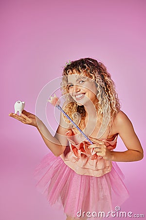 playful lovely blonde woman in pink Stock Photo