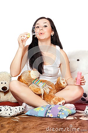 Playful pretty girl blow bubbles. Isolated Stock Photo