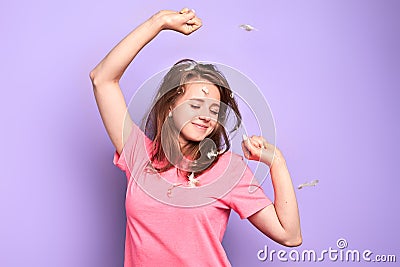 Playful student girl stretches after sleep, glad to have rest after hard week Stock Photo