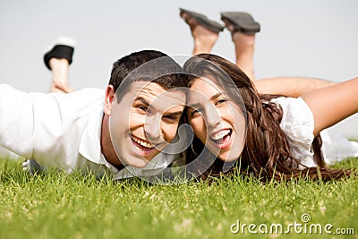 Playful young couple laying down Stock Photo