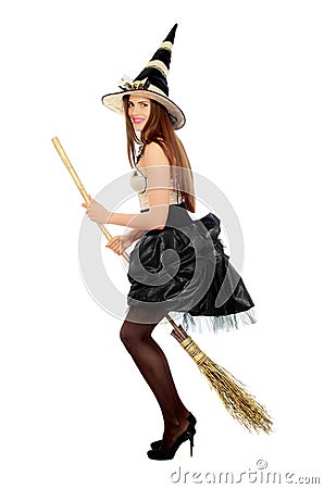 Playful young woman with a besom Stock Photo