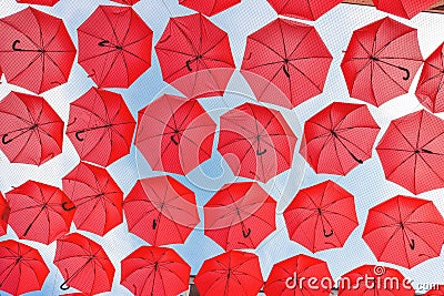 Red umbrellas in the sky Stock Photo