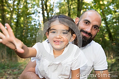 Playfull daughter child with bald man father outdoor Stock Photo