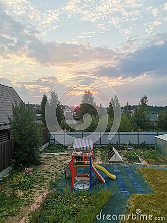 playground in the backyard. sunset in the distance. Stock Photo