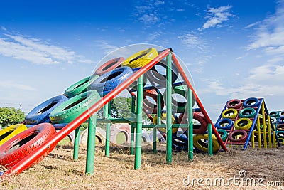 Playground built with old tires for children plays. Stock Photo