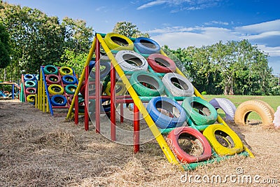 Playground built with old tires for children plays Stock Photo