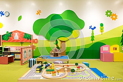 Playground with Toy Railway, Train, Bridge, Trees and Houses Editorial Stock Photo