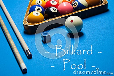 Playing billiard. Billiards balls and cue on billiards table. Bi Stock Photo